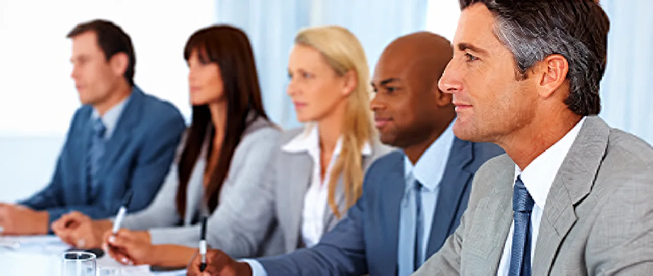 Business professionals participating in a meeting.